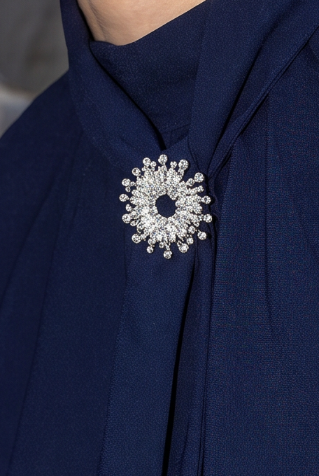 Silver-toned brooch with rhinestones