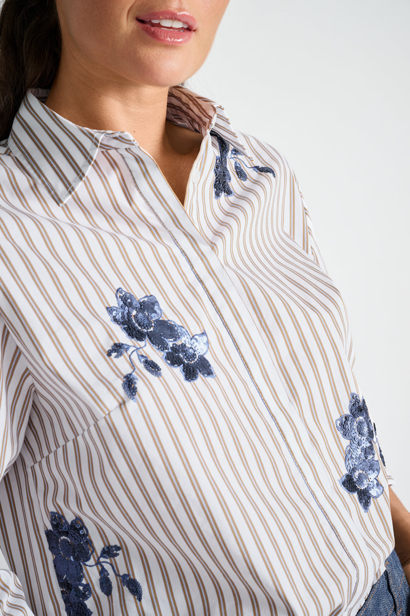 Light blue blouse with embroidery