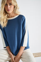 Blue jumper with boat neck and ecru cuffs