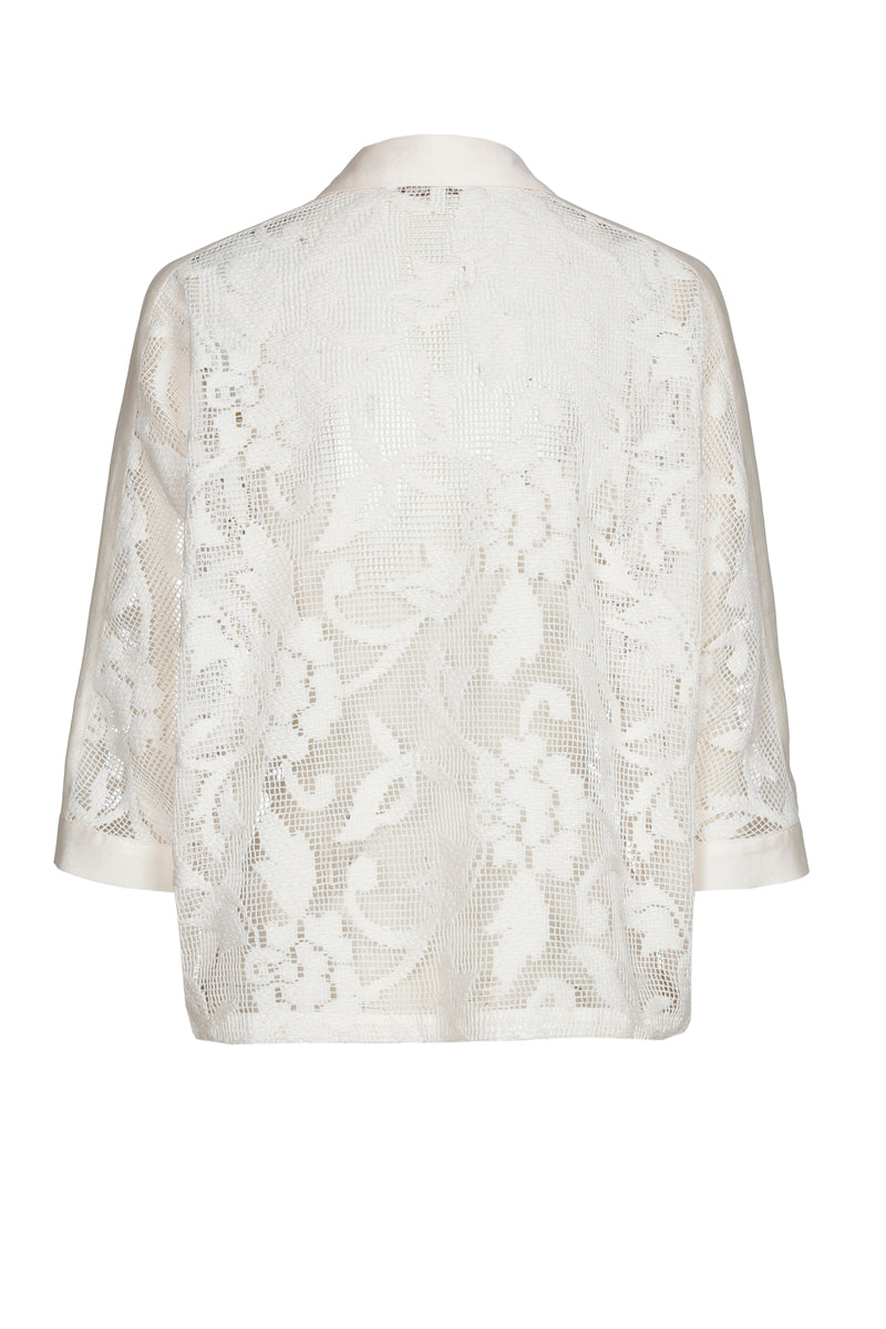 Witte polo-bloes met transparante bloemen