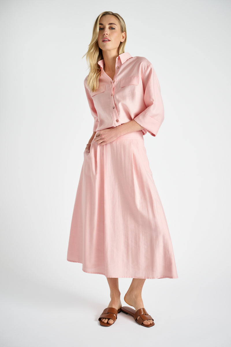 Straight and short pink shirt with breast pockets