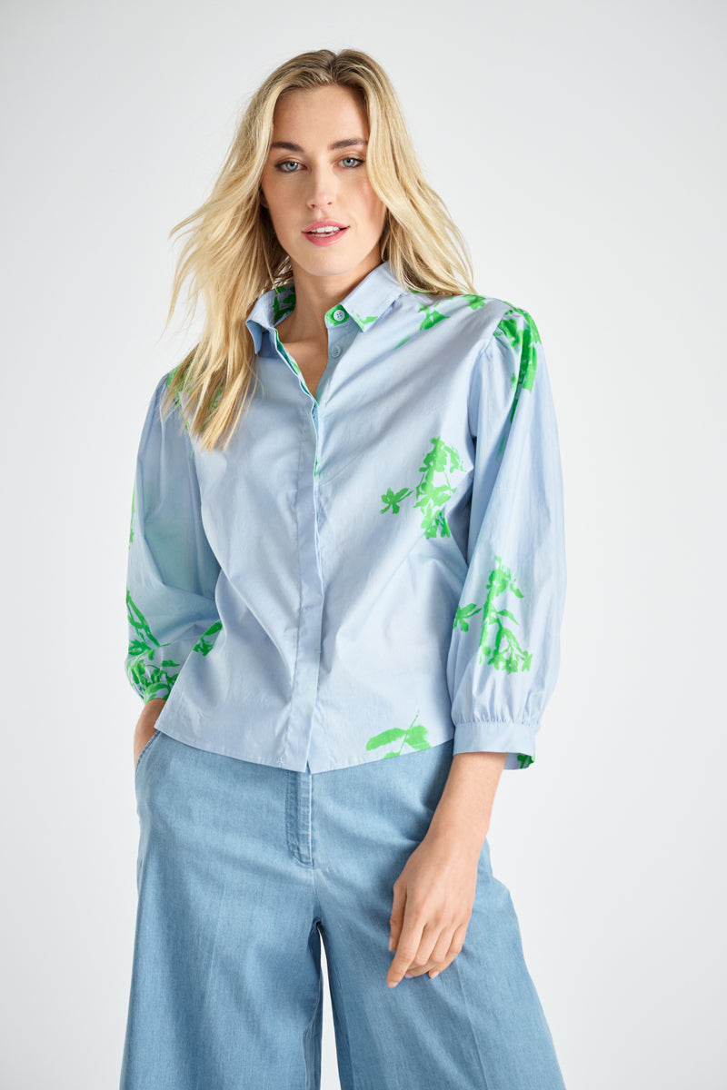 Blue shirt with green flower print