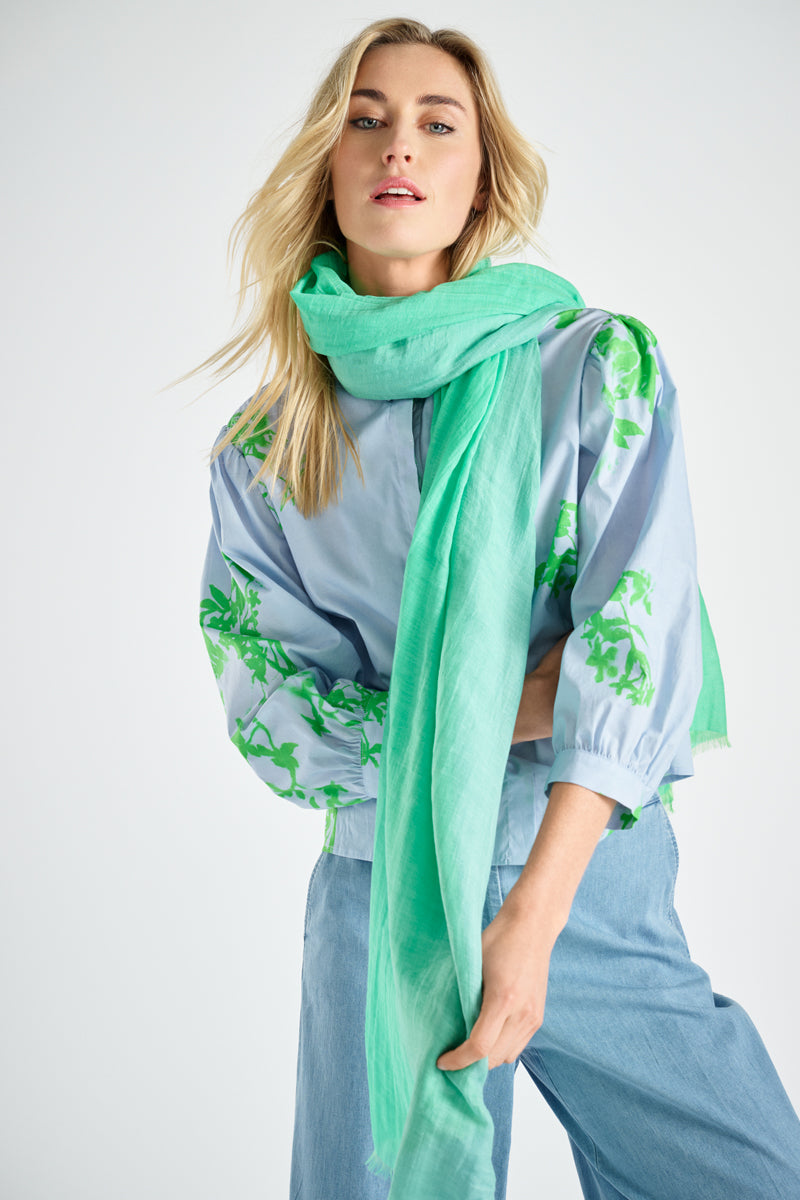 Blue shirt with green flower print