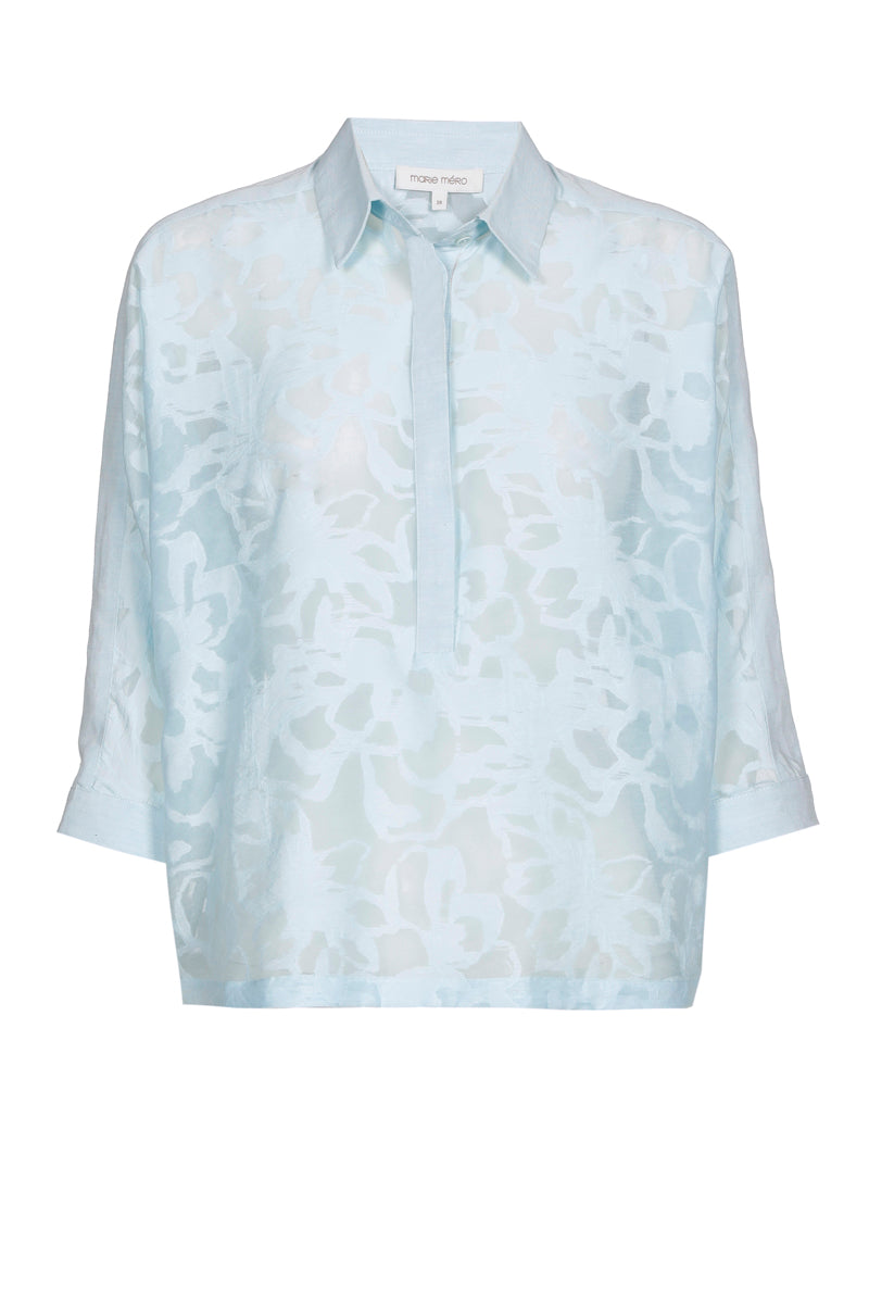 Chemisier-polo bleu clair à fleurs transparentes
