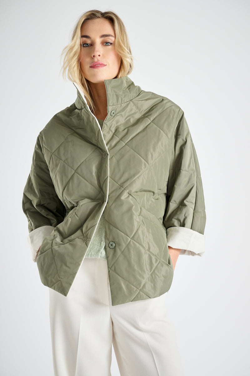Reversible jacket with stitching as a detail in khaki and white
