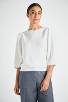 Witte trui met ronde hals