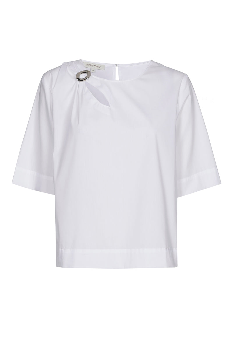 White shirt with brooch at the collar