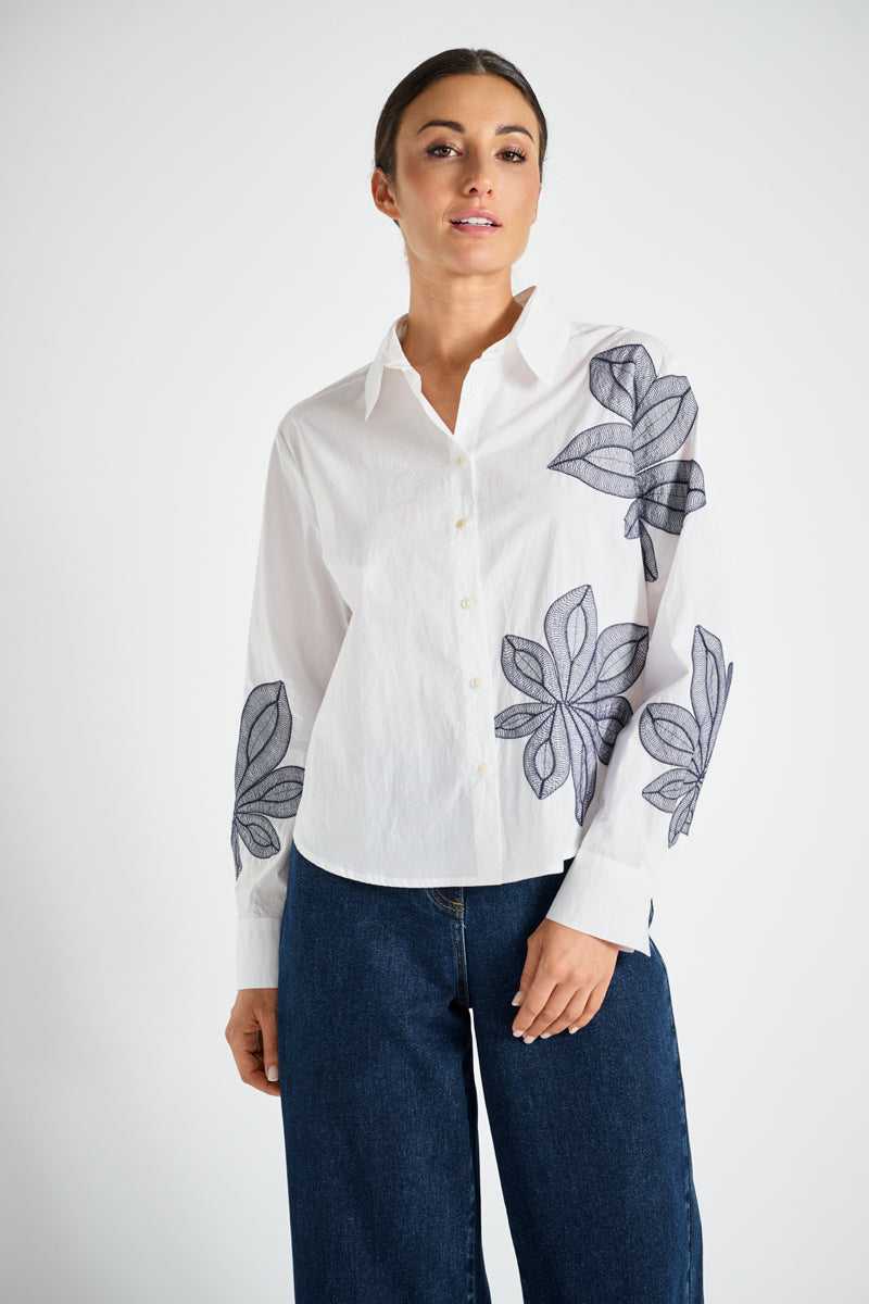 White shirt with blue flower