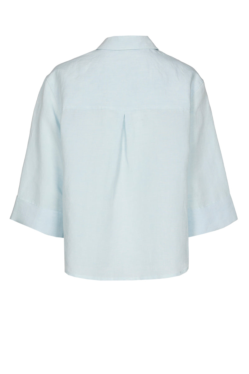 Straight and short turquoise shirt with breast pockets