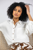 White blouse with breast pocket and exotic piping
