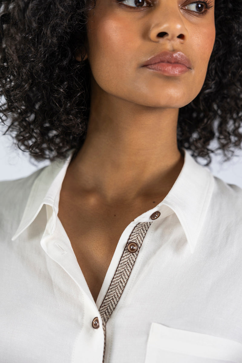 White blouse with breast pocket and exotic piping