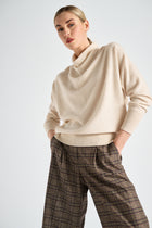 A lovely sand-coloured wool and cashmere jumper with a waterfall collar