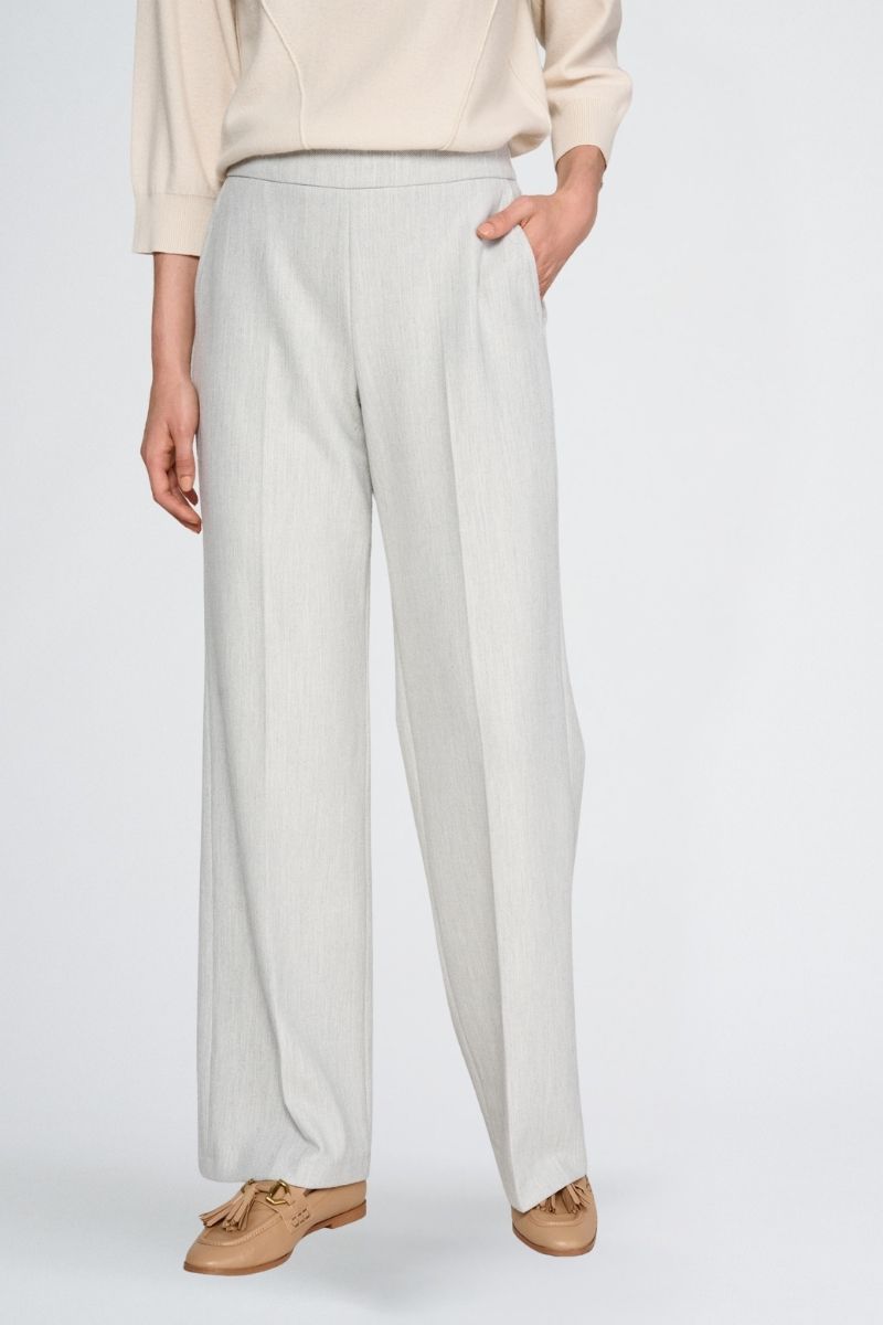 Wide grey trousers and elastic at the back of the waist